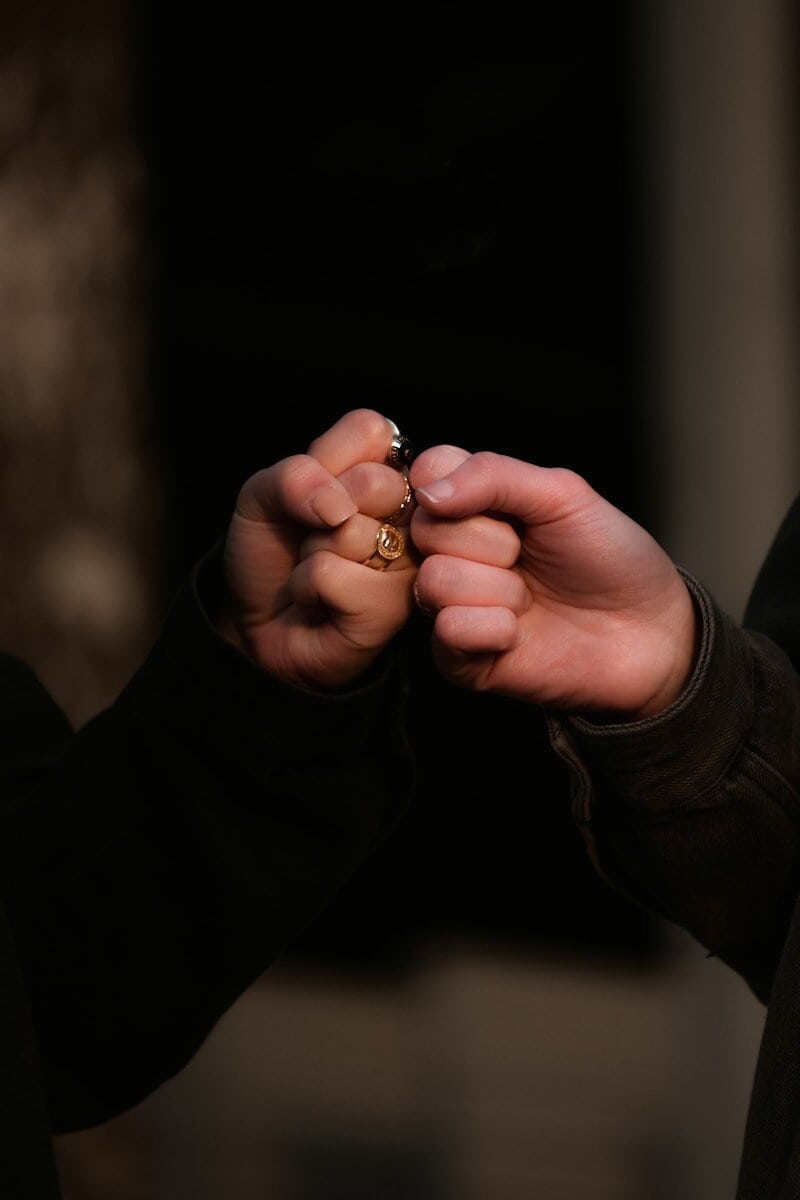Two people giving a celebratory fist bump
